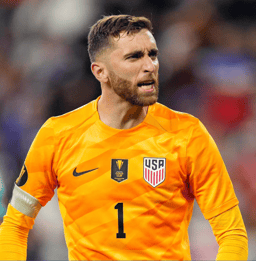 Football goalkeeper diving for a save