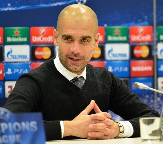 Pep Guardiola on the touchline during a match