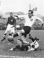 Vintage black-and-white photograph of an early football match