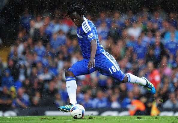 Striker controlling the ball during a Premier League match